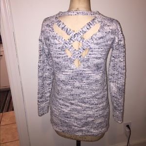 Soft asymmetrical sweater with crisscross back